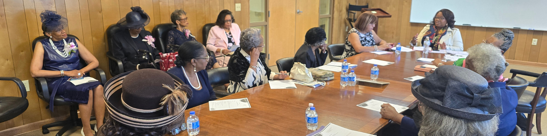 picture of women in front of church van. 